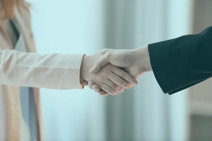 Two people shaking hands