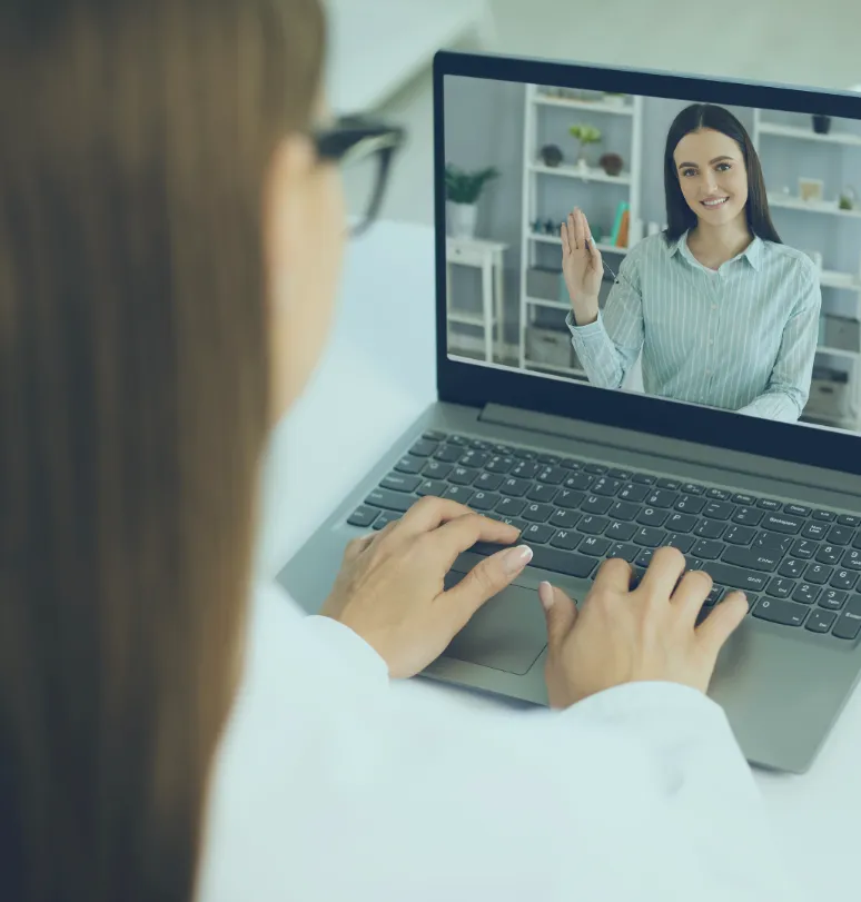 A video consultation on a laptop